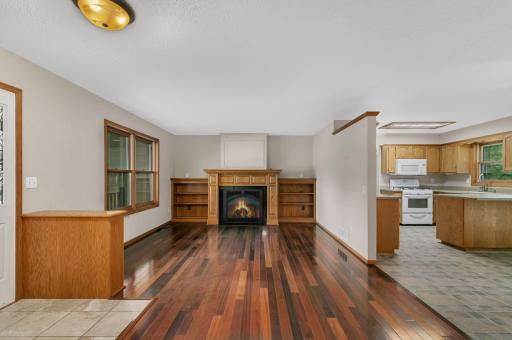 A warm and inviting gas fireplace anchors the living room.