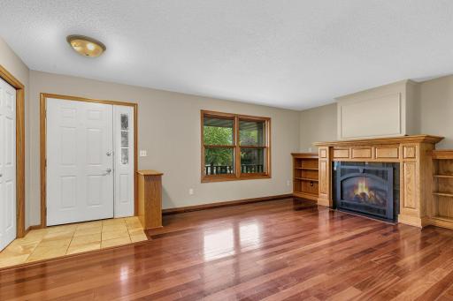 Beautiful cherry wood flooring welcomes you as you enter the home.