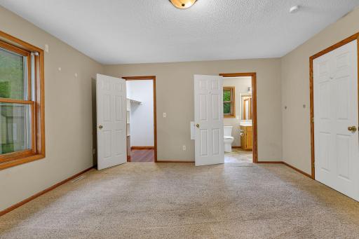 Spacious primary bedroom with convenient walk-through access to the main bath.
