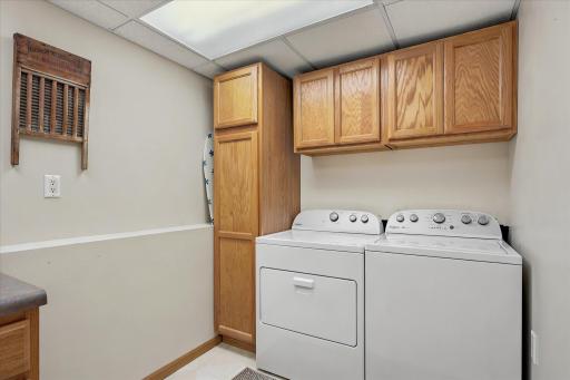 The laundry room is fabulous with the built in storage and countertop area for folding clothes plus a laundry sink.