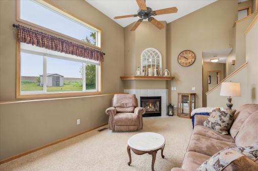 The living room area includes the beautiful fcorner fireplace. Large windows throughout the home let tons of sunlight into the rooms.