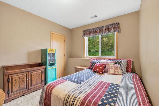 Another view of Bedroom #4 in the home complete with a large walk in closet.