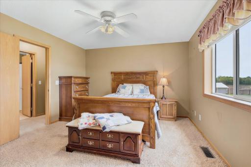 The private bedroom overlooks the large backyard area. Just wide open farmland in the rear of the home.