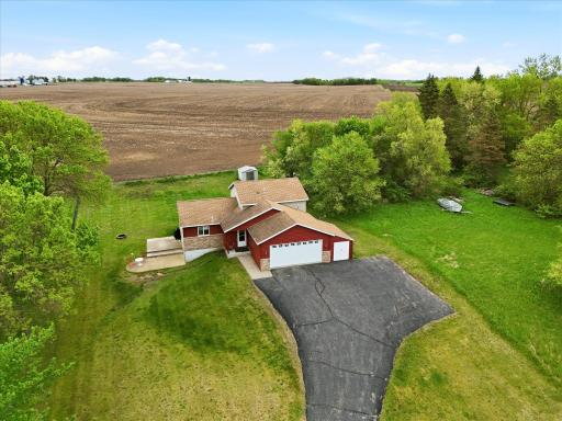 Fabulous setting on almost half acre with open farmland to the rear of the home and a view of Cedar Lake from the front.