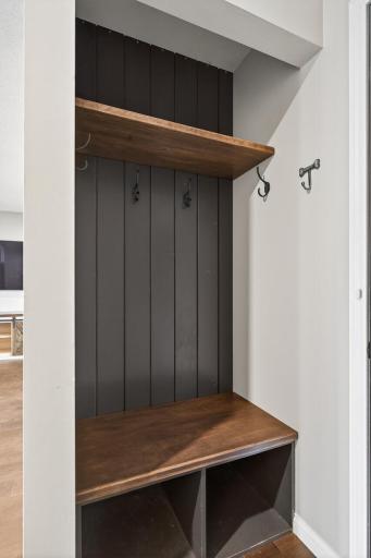 Stylish built-in entry storage with bench and hooks
