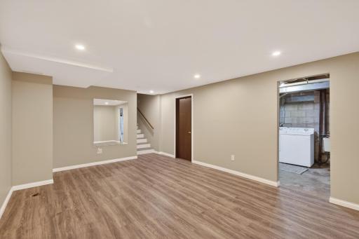 Bright flex space featuring recessed LED lighting and large mirror