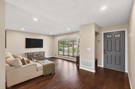 Spacious main-level living room with updated finishes