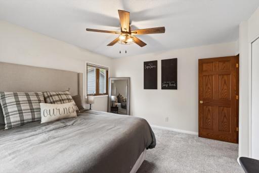 Spacious primary bedroom with newer carpet