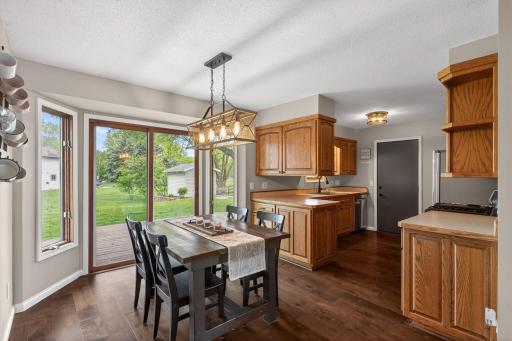 Dining area with backyard views and open kitchen flow