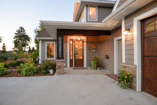 Welcome to this extraordinary custom-built luxury lake home on Indian Lake in Maple Lake!