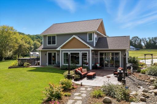 Built in 2022 by CAP Custom Homes, this executive retreat combines timeless craftsmanship, modern luxury, and breathtaking panoramic lake views less than an hour from the Twin Cities.