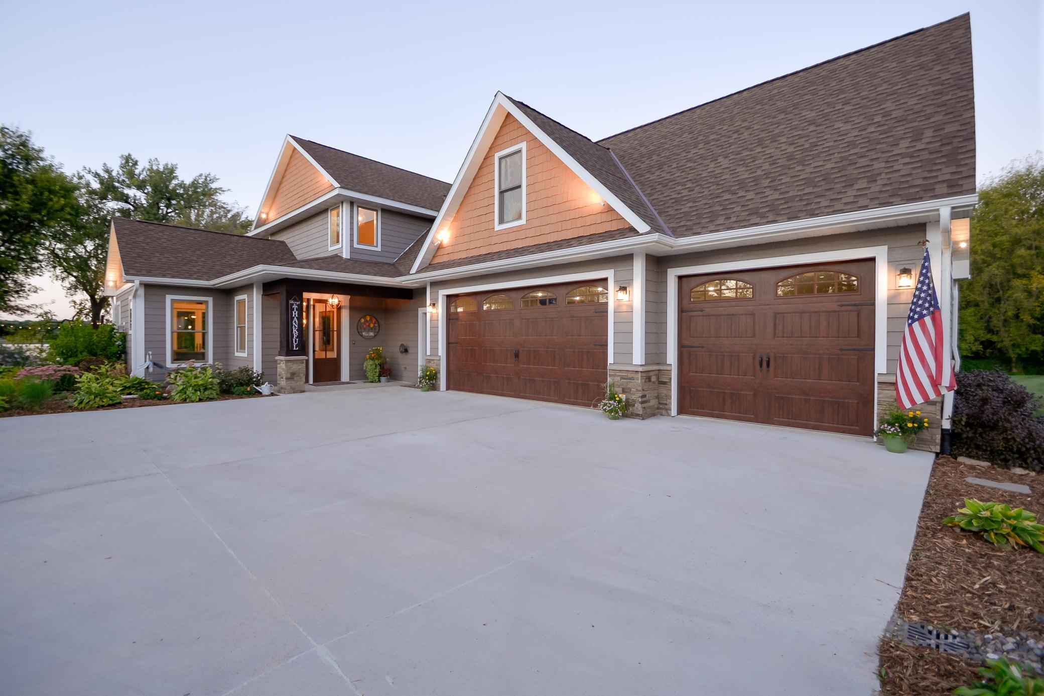 Additional features include in-floor heat, whole-home generator, whole-house water filtration system, oversized heated and insulated garage with mini-split A/C, LP SmartSide siding, concrete driveway, and fiber optic internet.