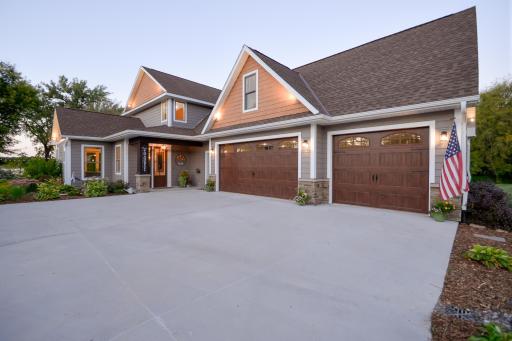 Additional features include in-floor heat, whole-home generator, whole-house water filtration system, oversized heated and insulated garage with mini-split A/C, LP SmartSide siding, concrete driveway, and fiber optic internet.