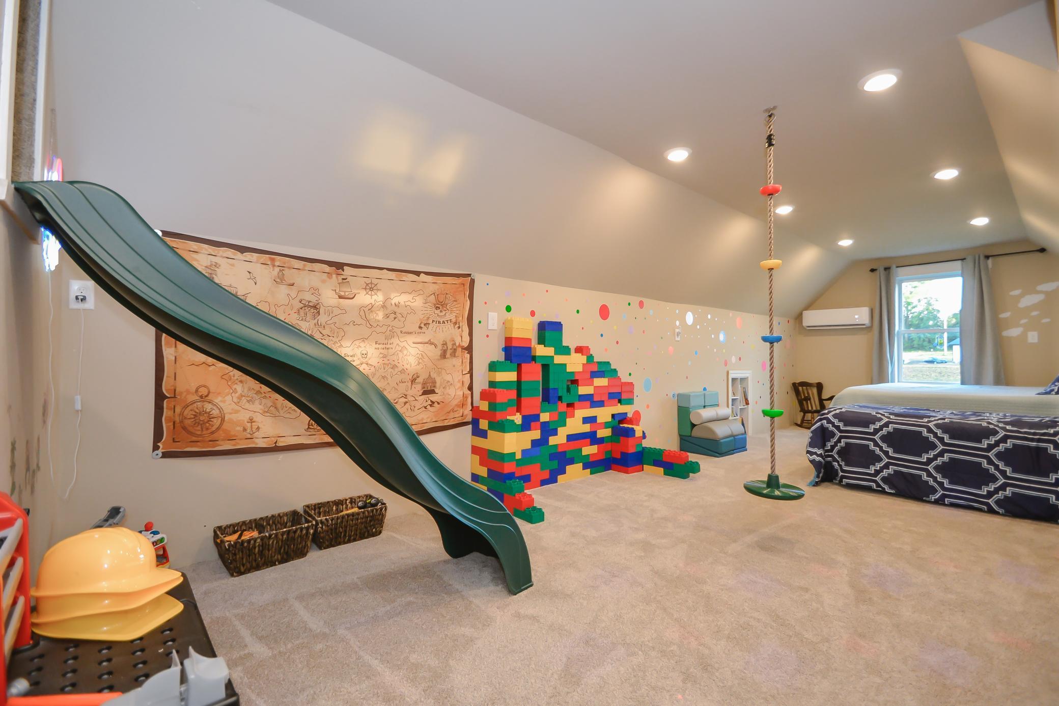 Slide features including tunnel slide access to garage
