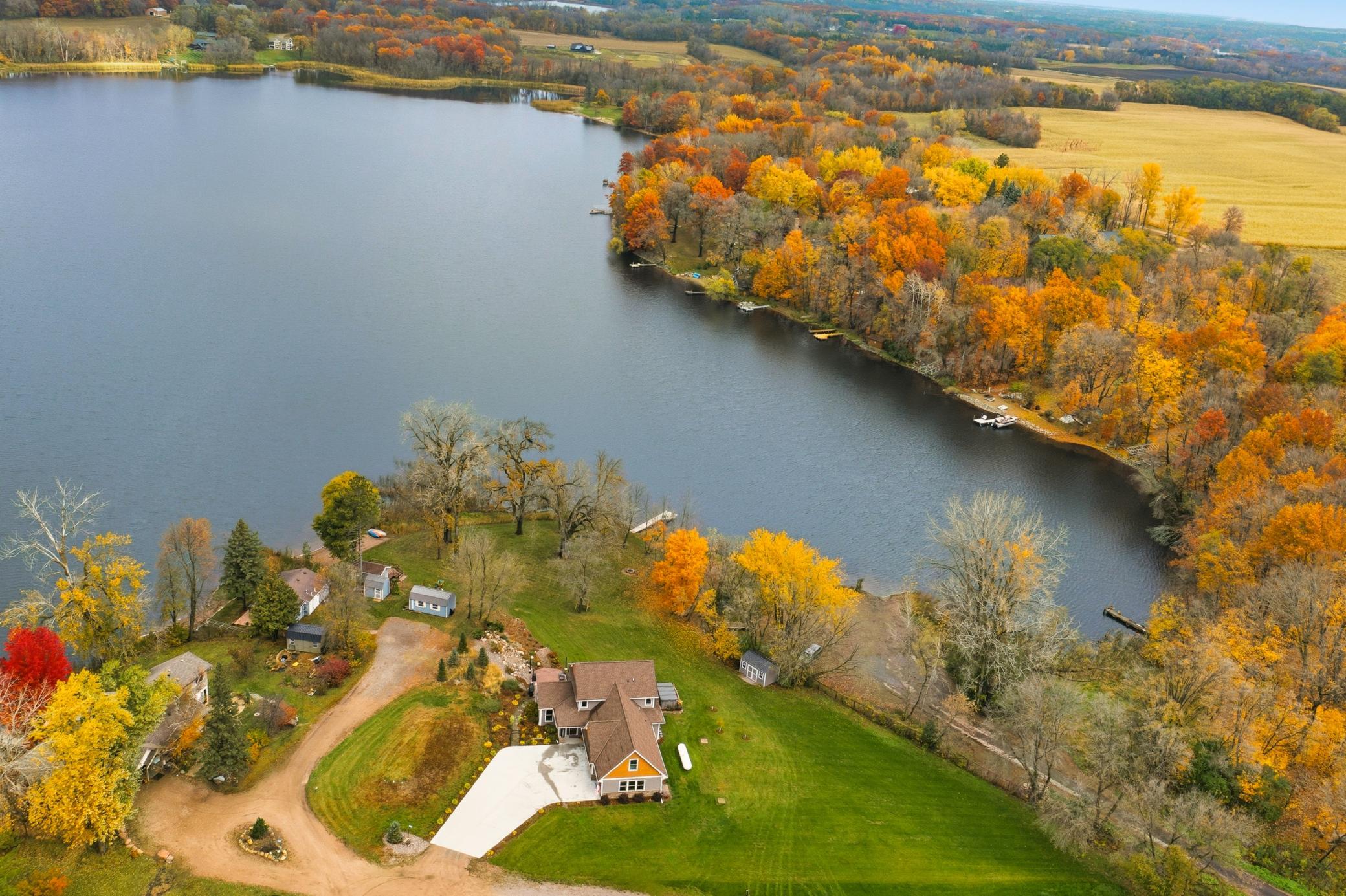 Step outside and enjoy the ultimate Minnesota lake lifestyle with a sandy shoreline, professionally landscaped grounds, waterfalls, mature trees, fruit trees, gardens, and 11-person spa overlooking the lake.