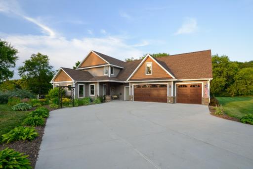 Welcome to this extraordinary custom-built luxury lake home on Indian Lake in Maple Lake!
