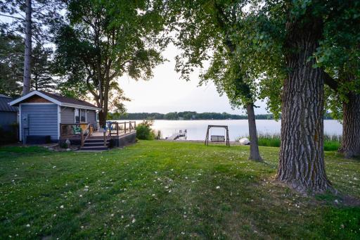 A charming seasonal lakeside cabin provide additional guest or entertaining space.