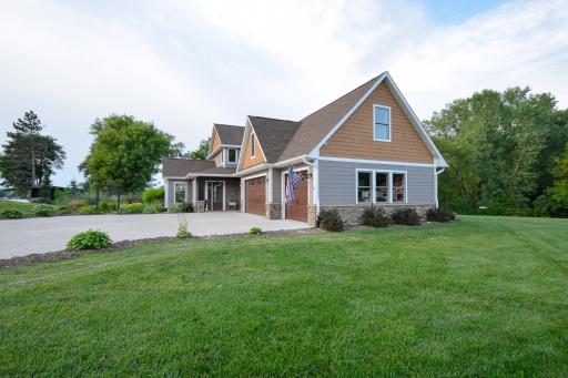 Additional features include in-floor heat, whole-home generator, whole-house water filtration system, oversized heated and insulated garage with mini-split A/C, LP SmartSide siding, concrete driveway, and fiber optic internet.