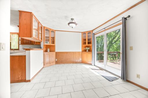 Dining room with access to the large deck overlook the backyard.