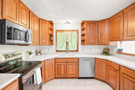 Upstairs the large kitchen features recently updated counters, a new microwave and tons of counter and cabinet space.