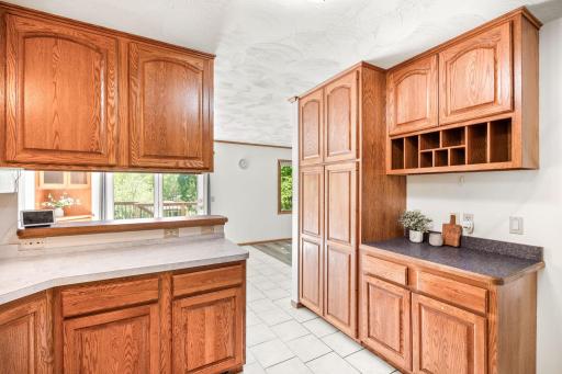 A coffee nook and large pantry cabinet and well thought out storage all around.