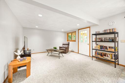 Perfect spot for movie nights or indoor/outdoor entertaining with easy porch access.