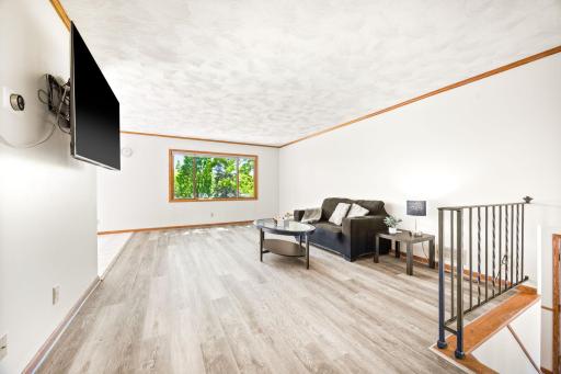 Large living room with so much natural light. Newer LVP flooring in living room and bedrooms.