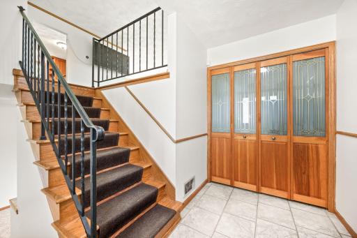 Enter into the foyer with large closet space, garage access and ample room to welcome guests and move around.