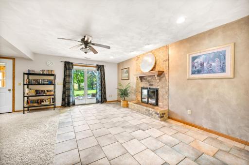 The spacious family room opens to a patio and three-season porch.