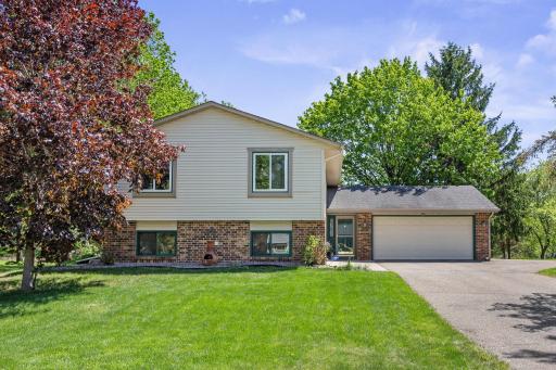 Welcome to this spacious home on a beautiful flat walk-out lot.