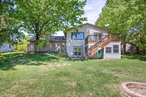 Additional storage space is hidden behind the wooded privacy fence.