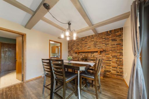 The dining room features a beautiful brick hearth.