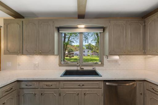 Modern upgrades includes under-cabinet lighting, stainless steel appliances and ample cabinet space.