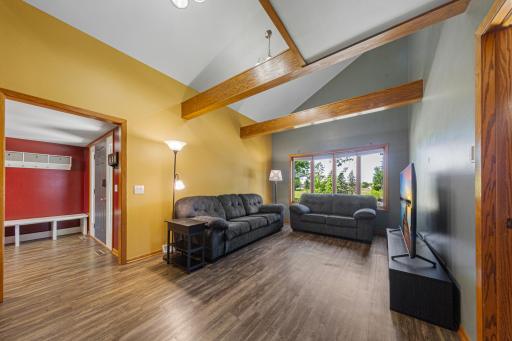 Main living room with beautiful exposed ceiling beams.