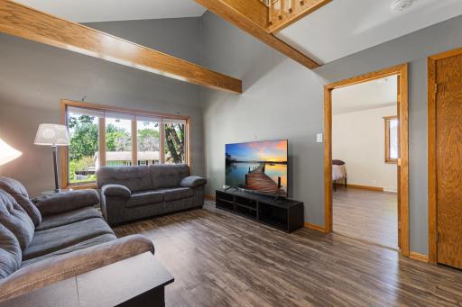The main level living room has vaulted ceilings, making this room feel open and inviting.