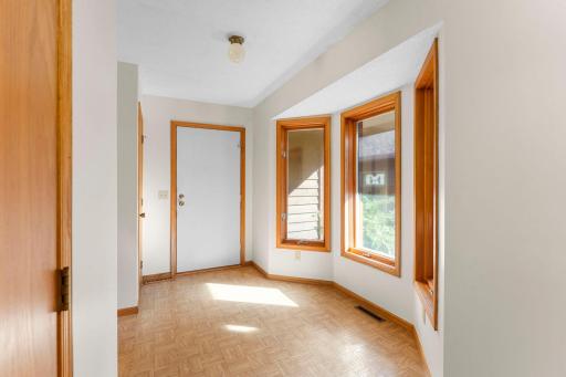 The entrance to the home from the garage offers space for a small table or for leaving belongings as you step inside.