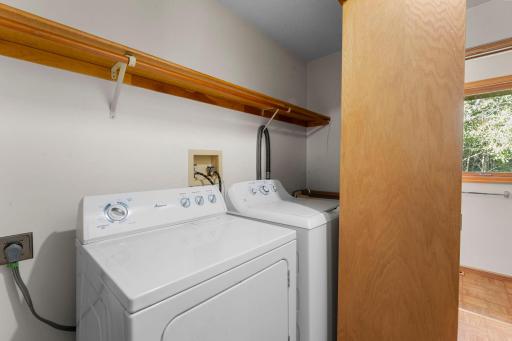 The washer and dryer are located in a hallway on the main level.