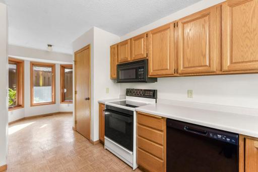 The kitchen has abundant cabinetry plus a large pantry.