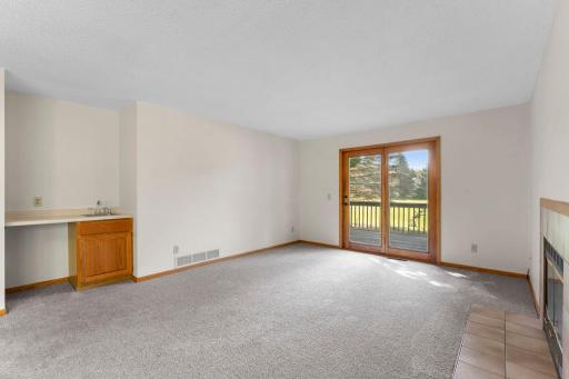 The living room has new carpet and a wetbar.