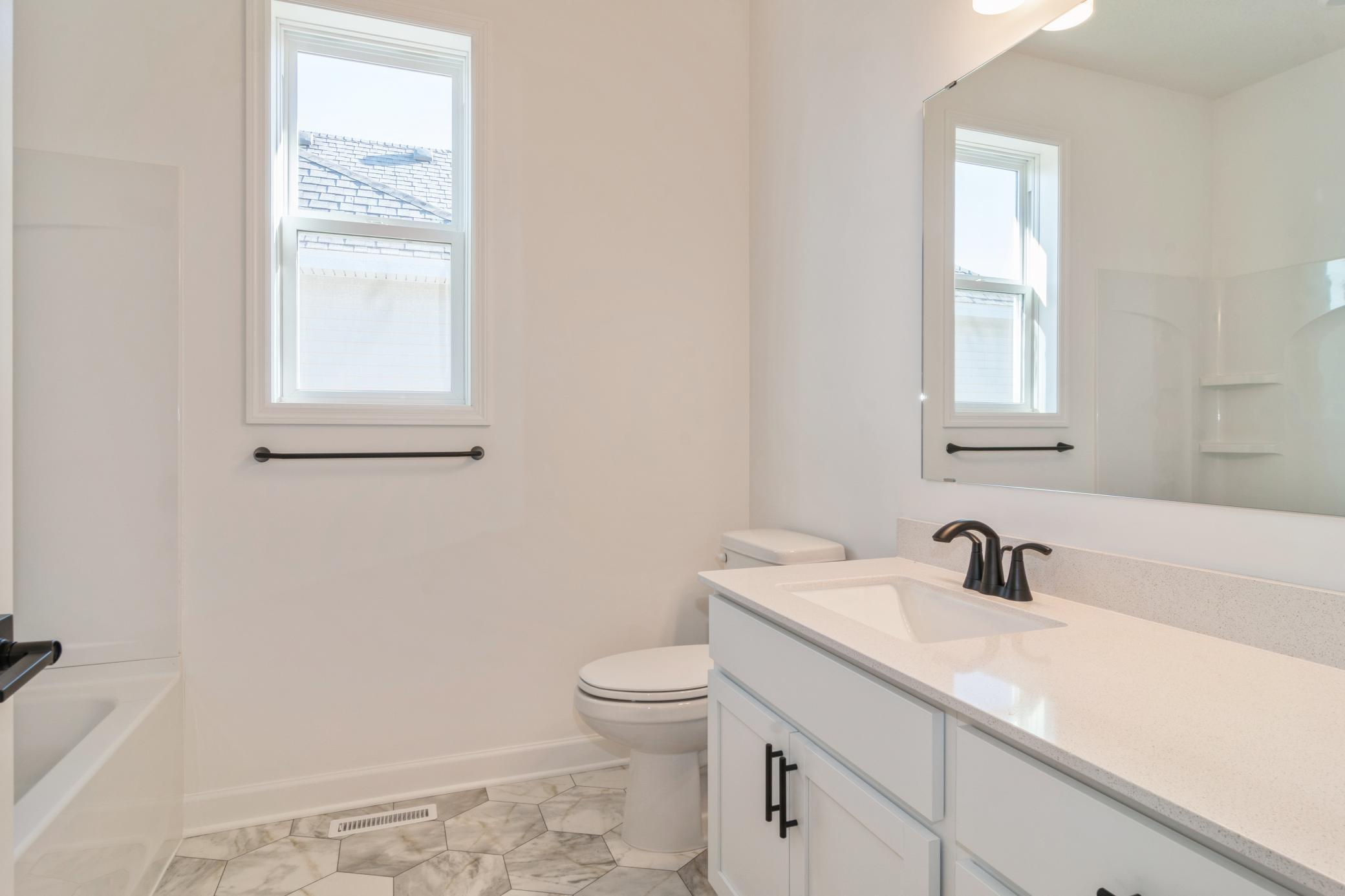 (Photo of a decorated model, actual home's finishes will vary slightly)