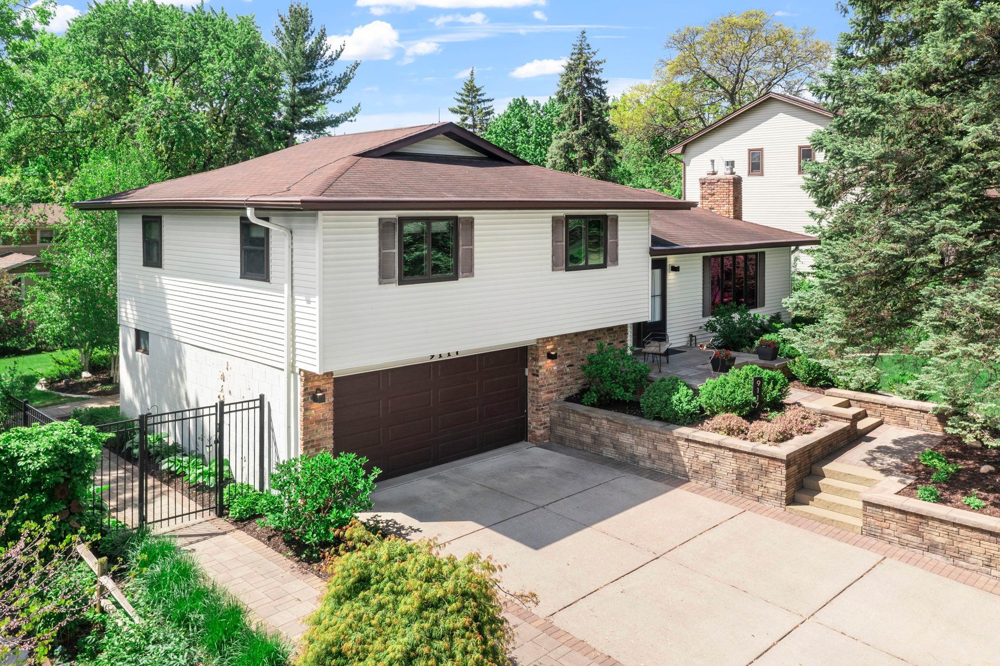 Professionally designed retaining wall, steps & paver sidewalk
