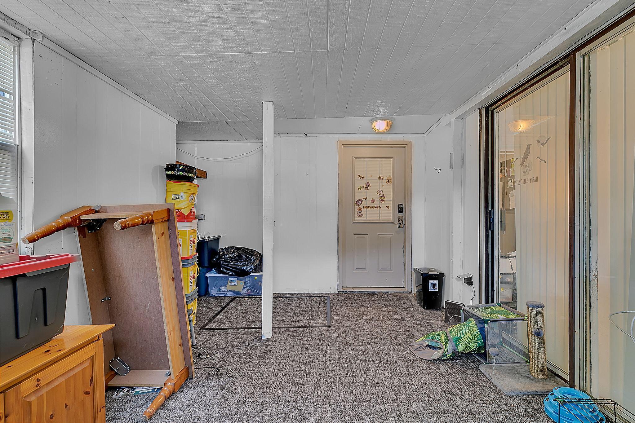 Main floor porch with basement access