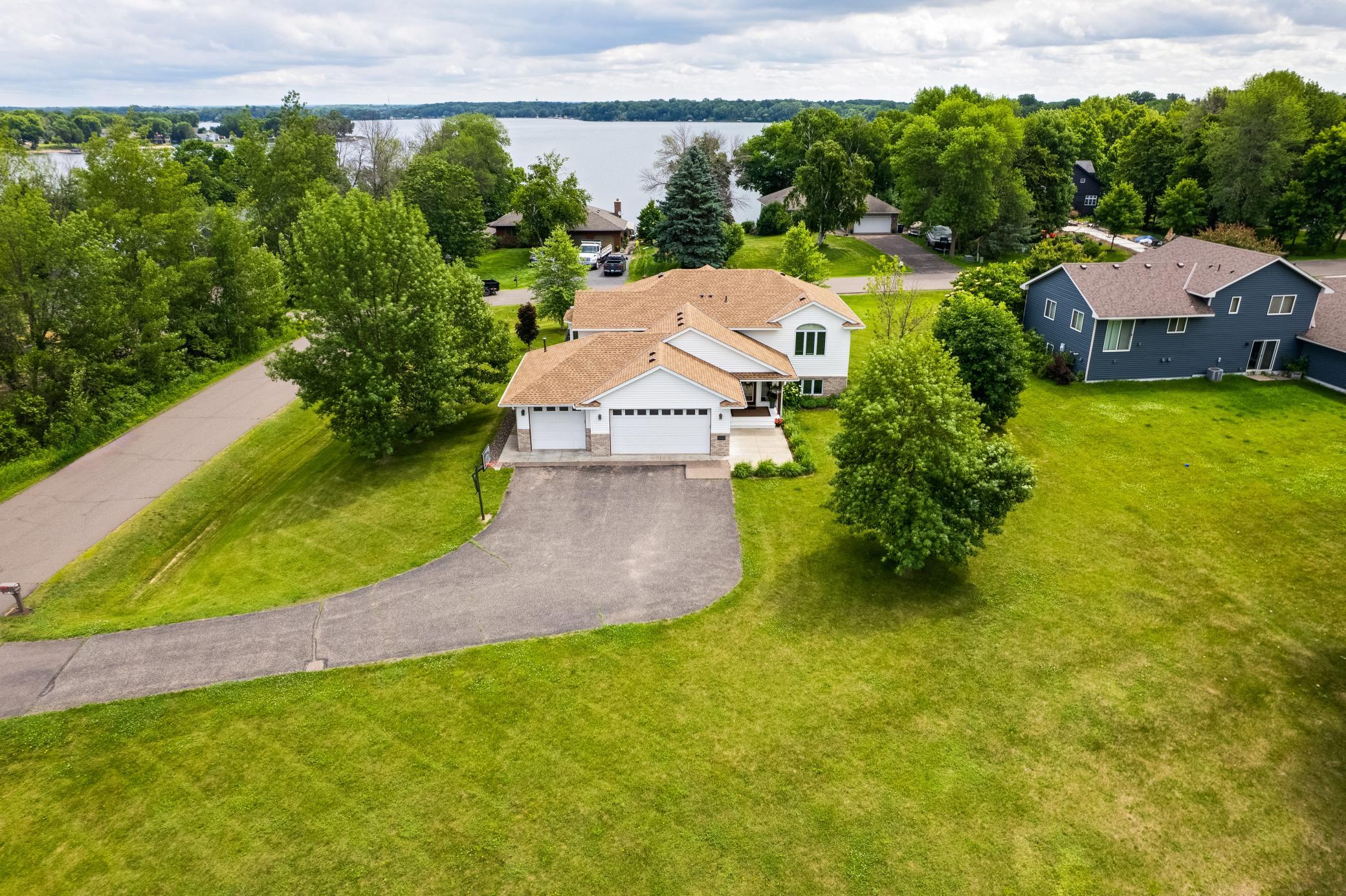 Machmeier front of house and lake.jpg