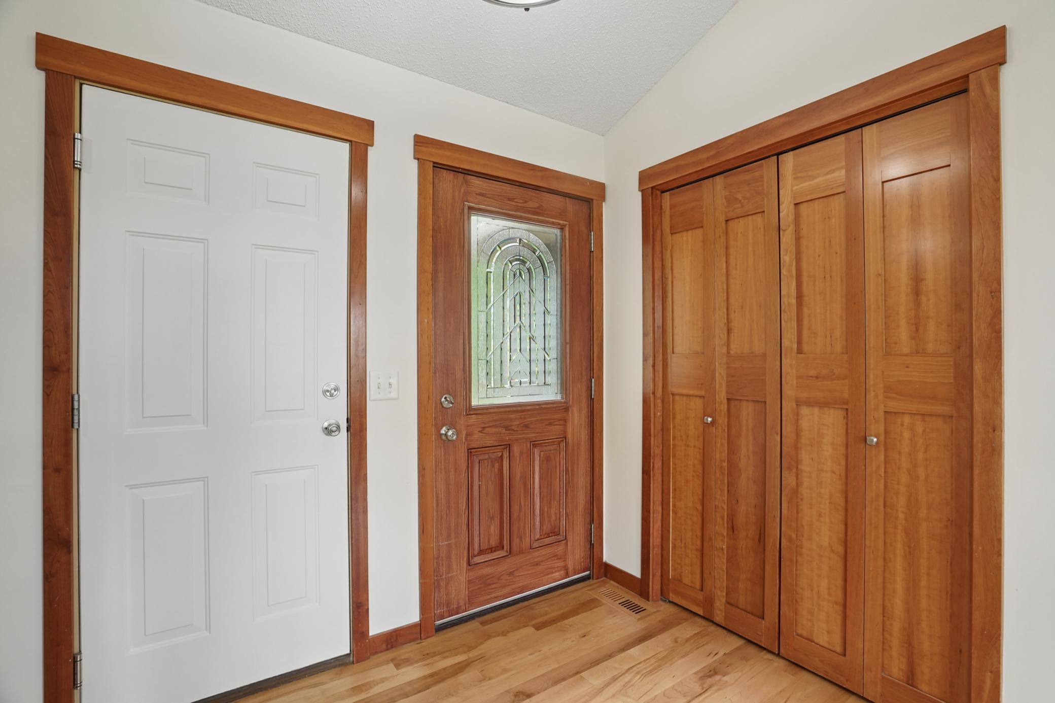 Entry with custom closet doors