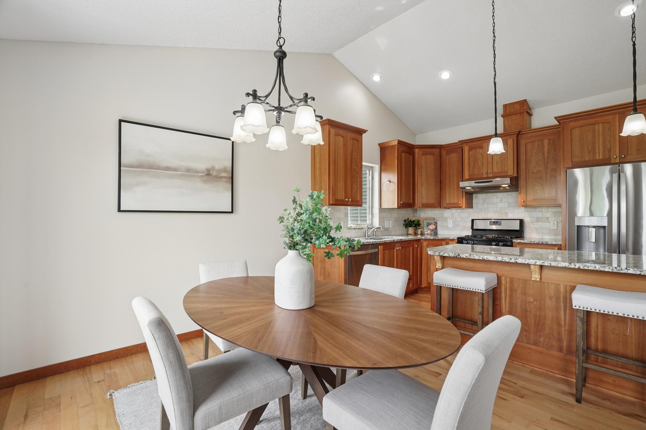 Custom kitchen cabinetry, kitchen island and granite counters