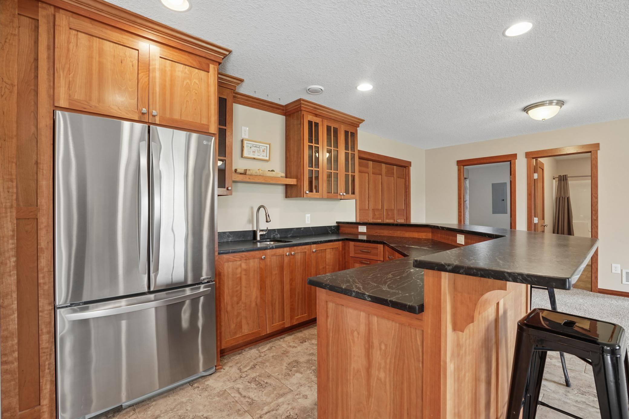 Lower level wet bar with full fridge
