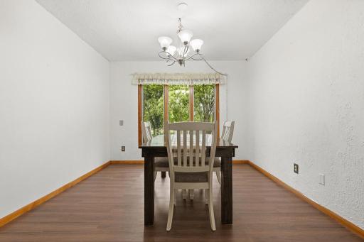 Great dining room space that overlooks the backyard. There is electrical by dining room light for you to pick a fixture of your choice and install it.