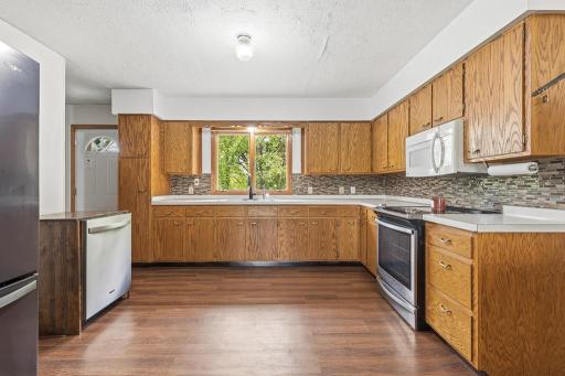 Spacious kitchen offering potential if you need an additional casual dining area, add a table or center island!