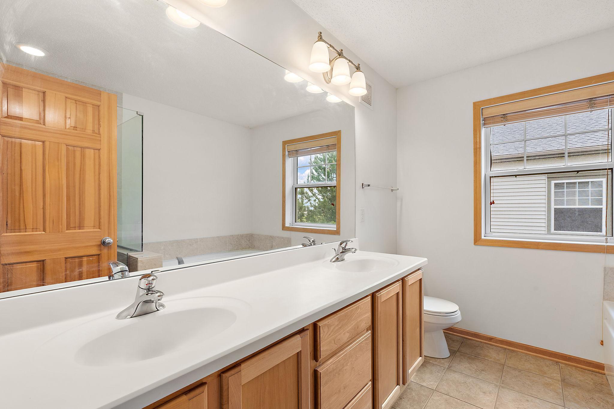 Primary full bath with dual vanity and separate tub/shower