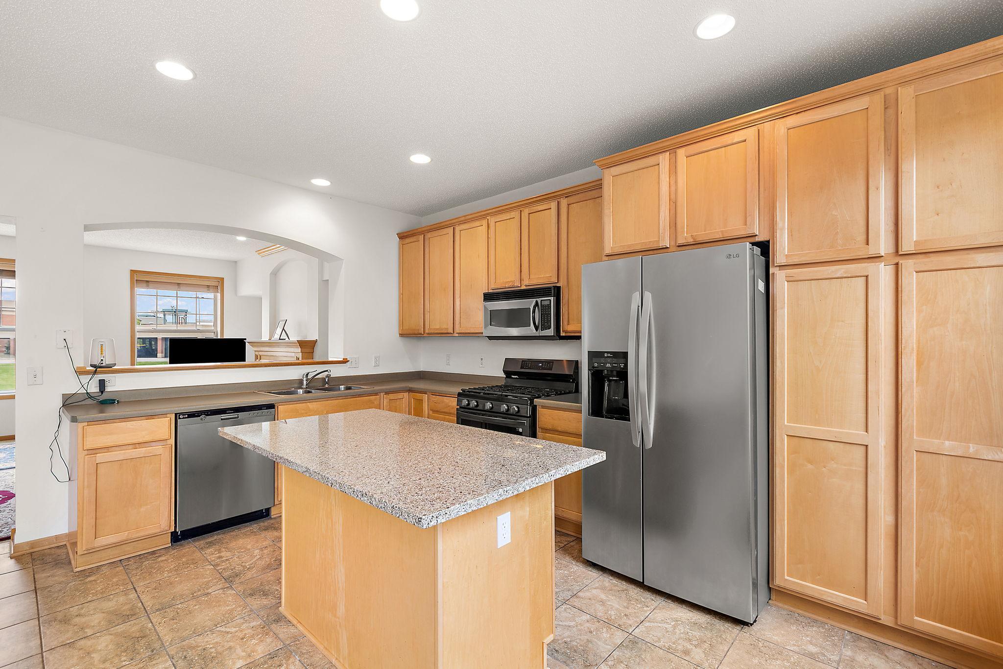 Spacious kitchen with center island and informal dining roomSpacious kitchen with center island and informal dining room
